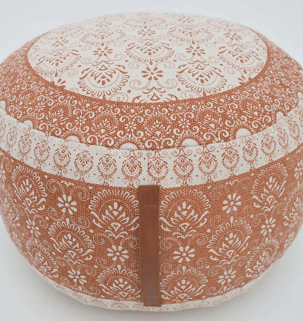 The RAMSHA HOME Round Bohemian Printed Pouf with Comfortable Insert PF 180 features intricate floral and geometric designs in brown and beige, plus a side handle, providing stylish decorative seating on a plain white background.