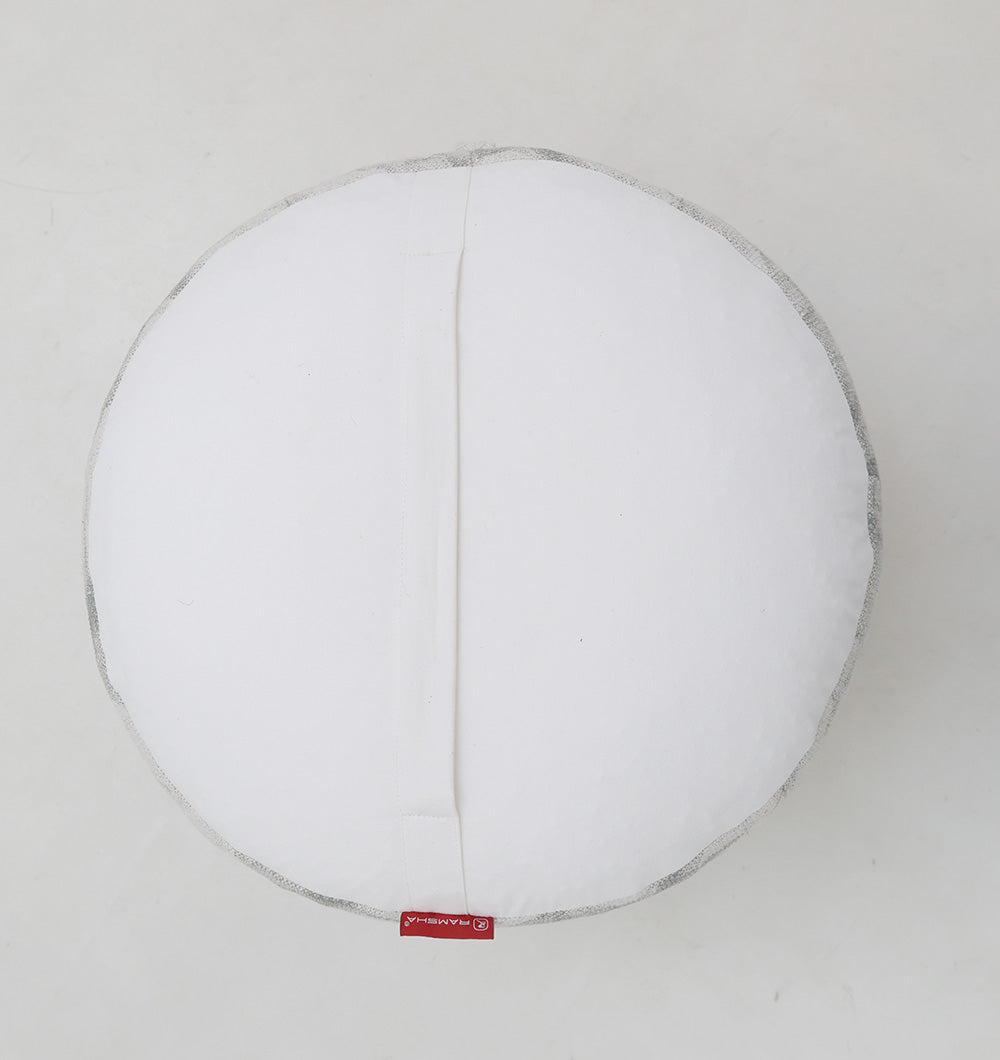 The RAMSHA HOME Round Bohemian Printed Pouf with Comfortable Insert PF 182 features a stylish design, gray trim, and a small red fabric tag. Photographed from above, it offers supportive bean bag filling for added comfort.