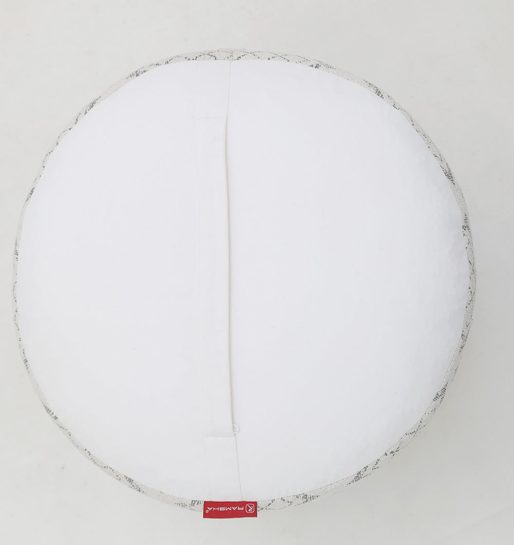 The RAMSHA HOME Round Bohemian Printed Pouf with Comfortable Insert PF 183 features a white cushion, light grey patterned edge, and a red fabric tag—ideal for stylish home décor when set against any plain white background.
