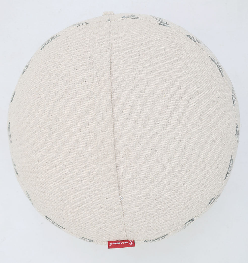 The RAMSHA HOME Round Bohemian Printed Pouf with Comfortable Insert PF 188 features beige fabric, visible stitching, and a red tag—an eye-catching accent to elevate your décor. Photographed on a plain white background.
