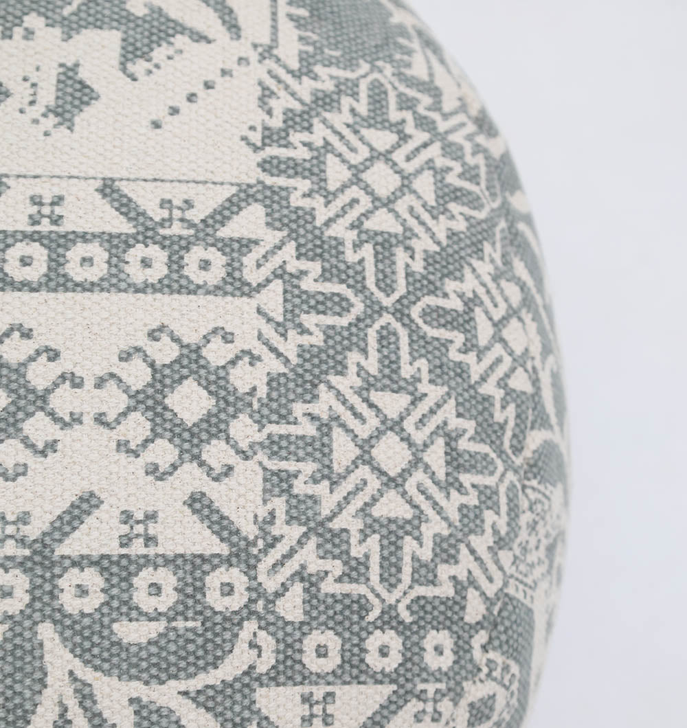 Close-up of RAMSHA HOME's Bohemian Grey Color Printed Pouf with Comfortable Insert PF 189, showing a light gray and white geometric fabric featuring repeating symmetrical motifs—perfect for home décor or upholstering accent pieces.