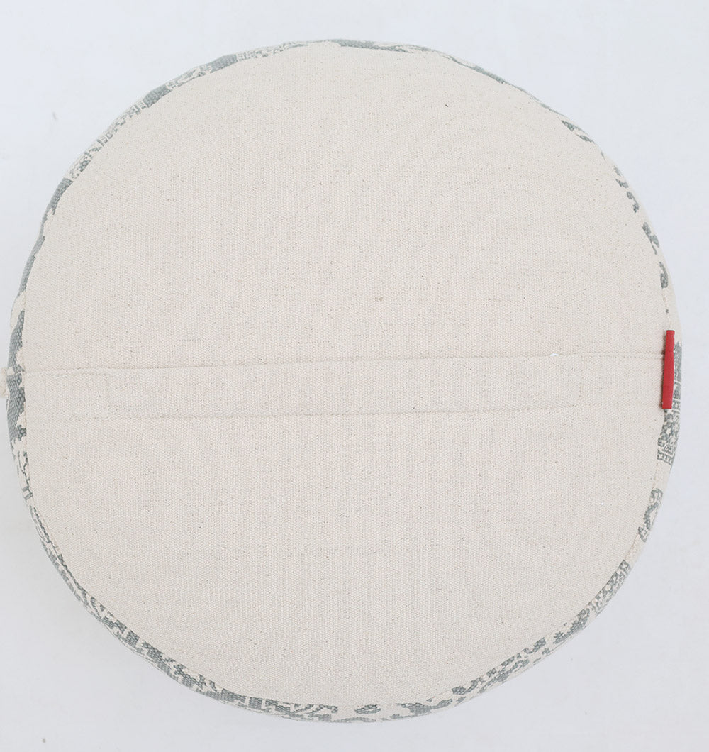 The RAMSHA HOME Bohemian Grey Color Printed Pouf with Comfortable Insert PF 189 features a subtle patterned trim, a central seam, and a small red tag on the right edge; perfect for enhancing your home décor.