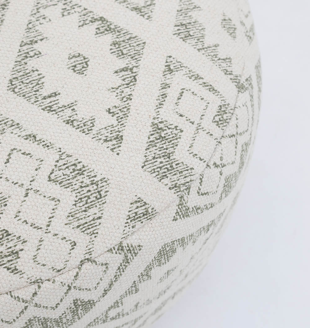 A close-up of the RAMSHA HOME Luxury Round Floor Pouf with Leather Handle PF 190, featuring a geometric pattern in muted green and cream. Its elegant fabric texture and angular design enhance your home décor.