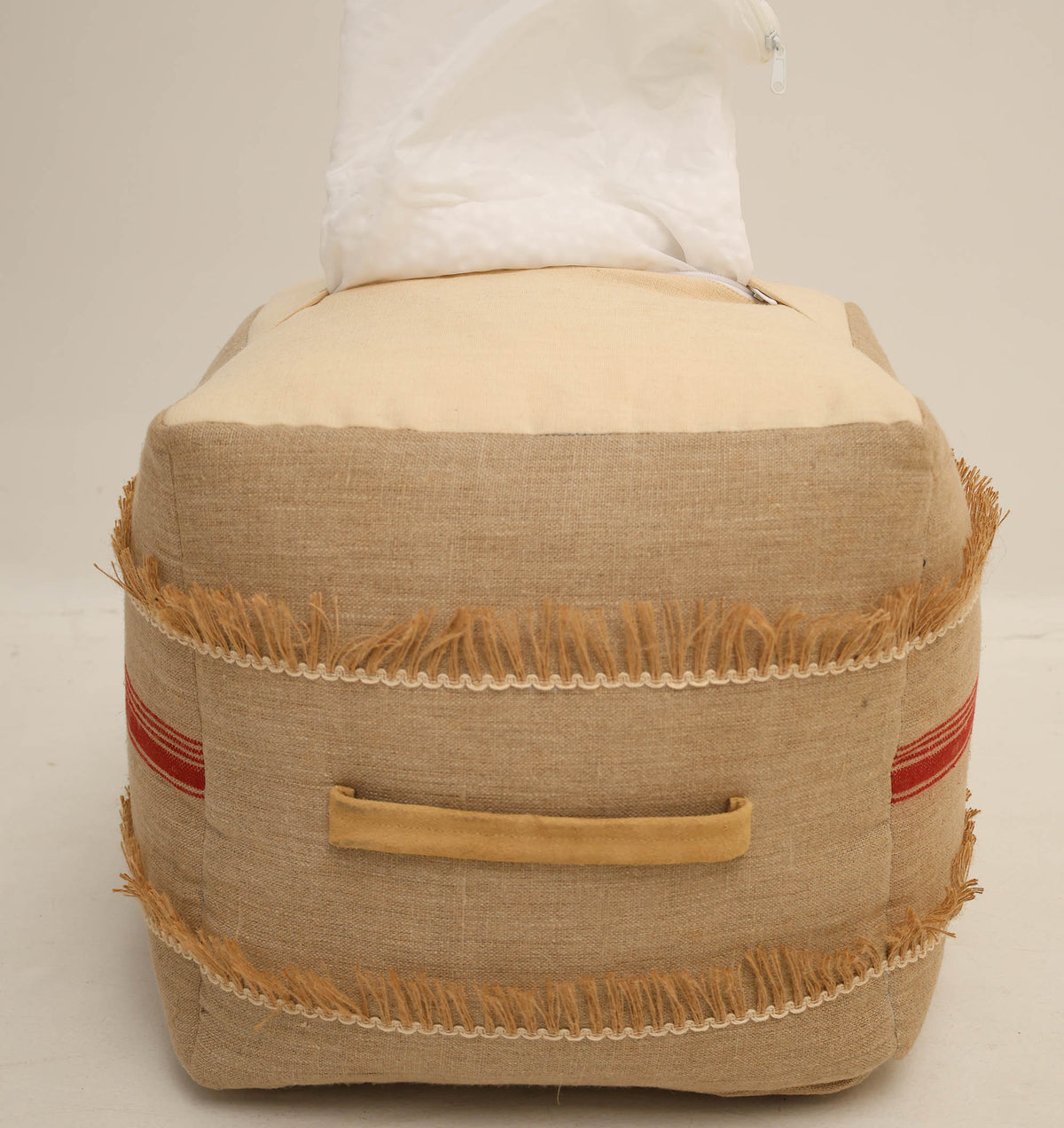 Introducing the Square Jute Floor Pouf with Fringes PF 192 by RAMSHA HOME. This square beige pouf features charming fringe trim, red side stripes, and a convenient yellow handle. Stylish and versatile, it works beautifully as an accent piece—adding a playful yet sophisticated touch to your decor. Pair it seamlessly with a fabric tissue box cover or other jute accessories for a cohesive look.