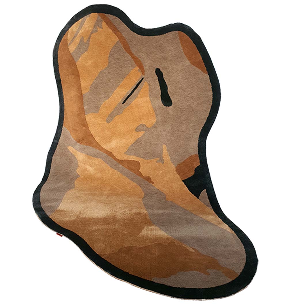 The Curved Shaped Multi Colored Carpet CMN-03 by RAMSHA HOME features artistic brown, tan, and black hues in an abstract face-like design, adding modern flair and style to any room.