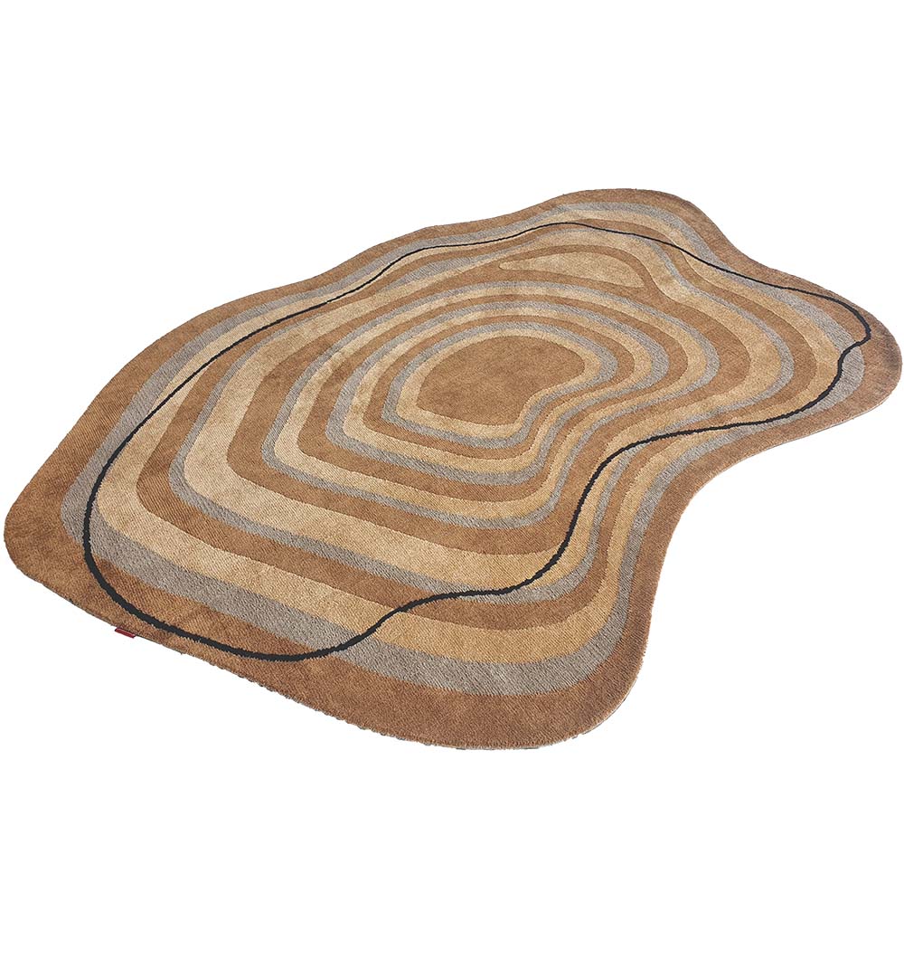 The Curved Shaped Multi Colored Carpet CMN-08 by RAMSHA HOME features rich brown and beige wavy rings in a modern abstract design, resembling geological layers with its irregular, topographic-inspired shape.