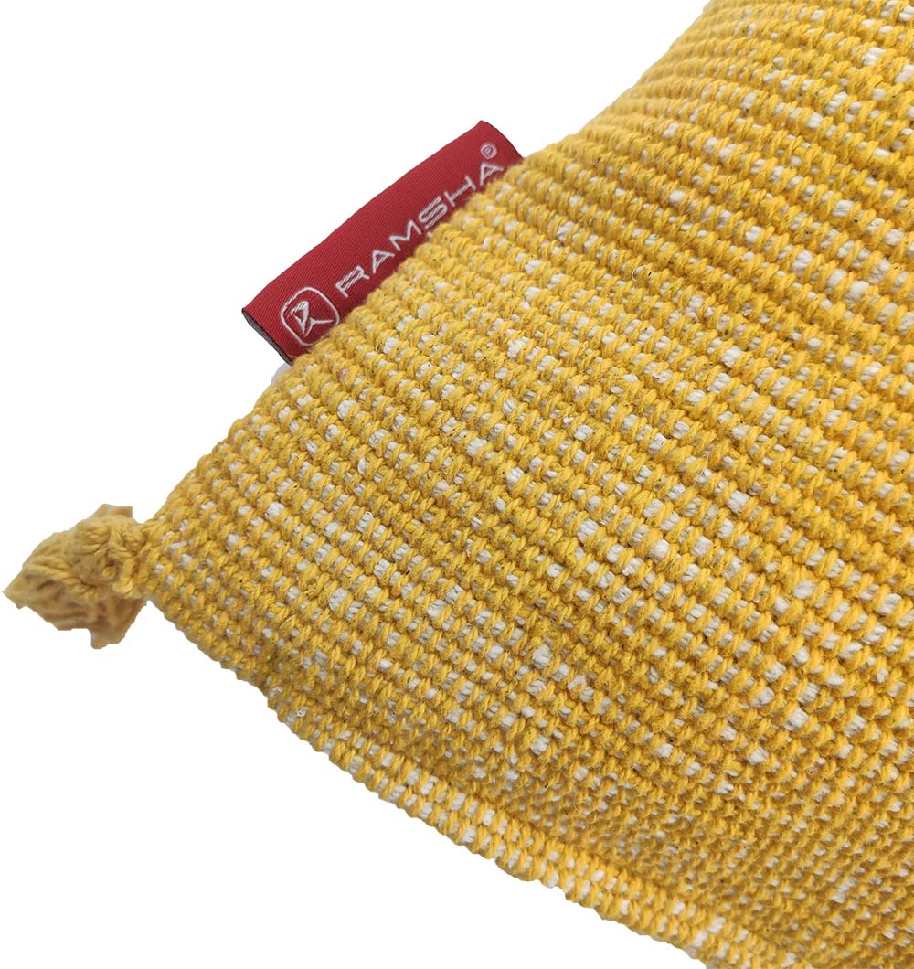 Close-up of the RAMSHA HOME Cotton & Polyester Natural & White Color Cushion With Filler (CS-157), showing its woven design, knotted corner, and red RAMSHA tag sewn on the seam.