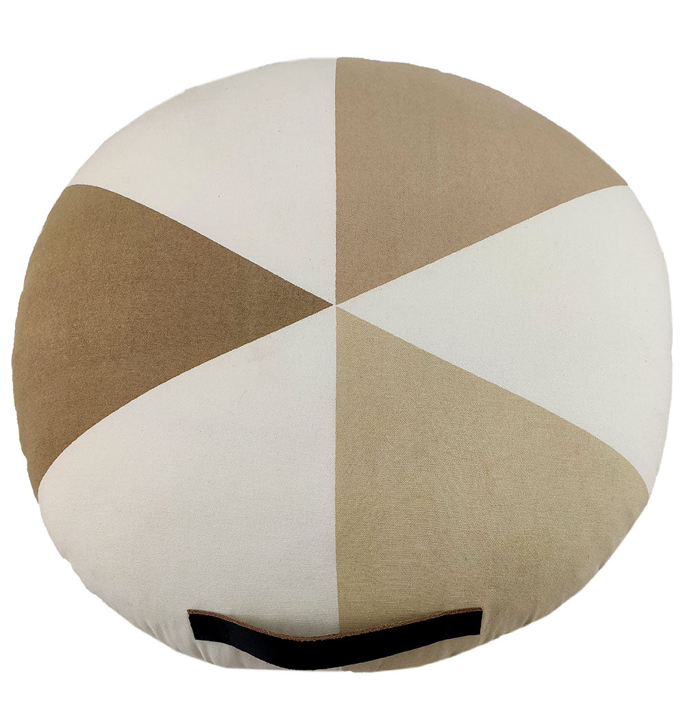 The RAMSHA HOME Round Cotton Cushion CS-225 features a pinwheel pattern in beige and white with alternating triangular sections and a black fabric handle attached near the bottom.