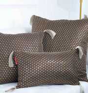 RAMSHA HOME Polyester Cushion Black and Gold With Tassel: Three plush decorative cushions—two square, one rectangular—boast bold geometric designs, arranged on a white background to elevate any modern space.