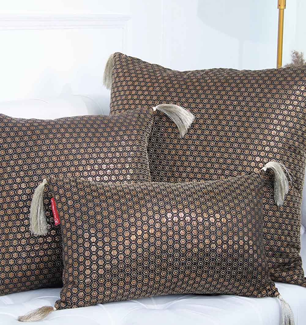 RAMSHA HOME Polyester Cushion Black and Gold With Tassel: Three plush decorative cushions—two square, one rectangular—boast bold geometric designs, arranged on a white background to elevate any modern space.
