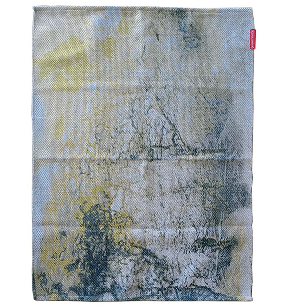 The RAMSHA HOME Geometry Pattern Printed Durry DD-009 features a modern rectangular design in green tones, with a stylish abstract pattern and a small red tag near the top right edge for a subtle touch.