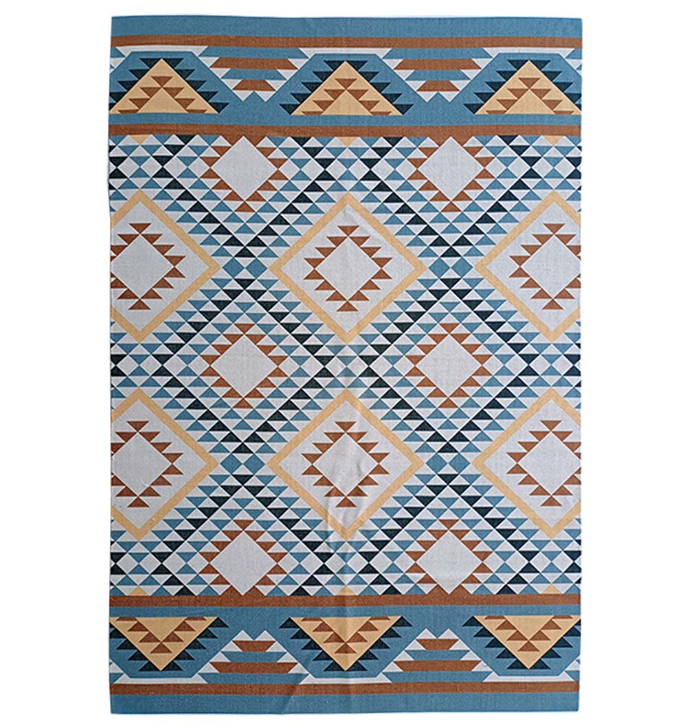 The RAMSHA HOME Geometric Diamond Tribal Blue & Tan Rug – DD 016 features a rectangular design with blue, beige, brown, and white diamond and triangle patterns plus symmetrical motifs and horizontal borders.