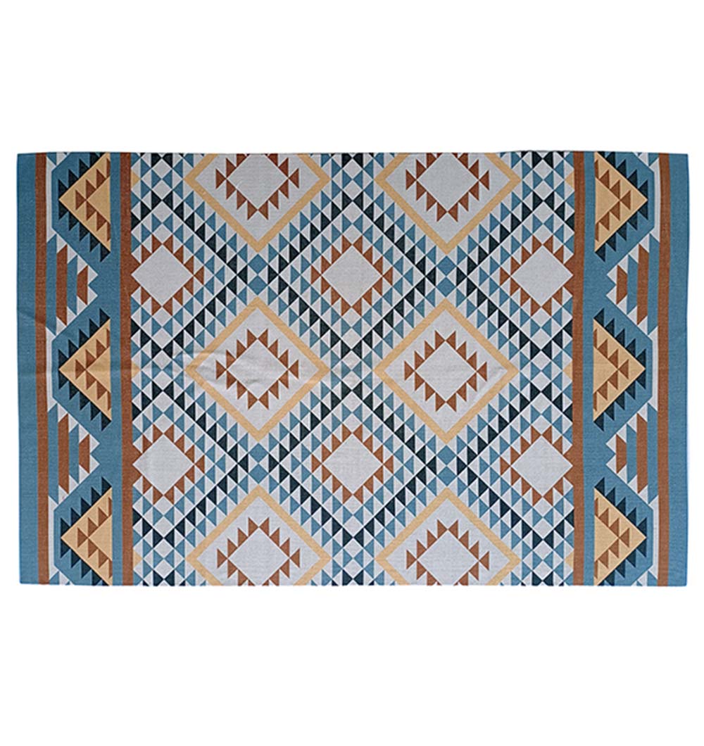 The RAMSHA HOME Geometric Diamond Tribal Blue & Tan Rug – DD 016 features symmetric diamond and triangle patterns in blue, tan, brown, and white with borders on the short edges.
