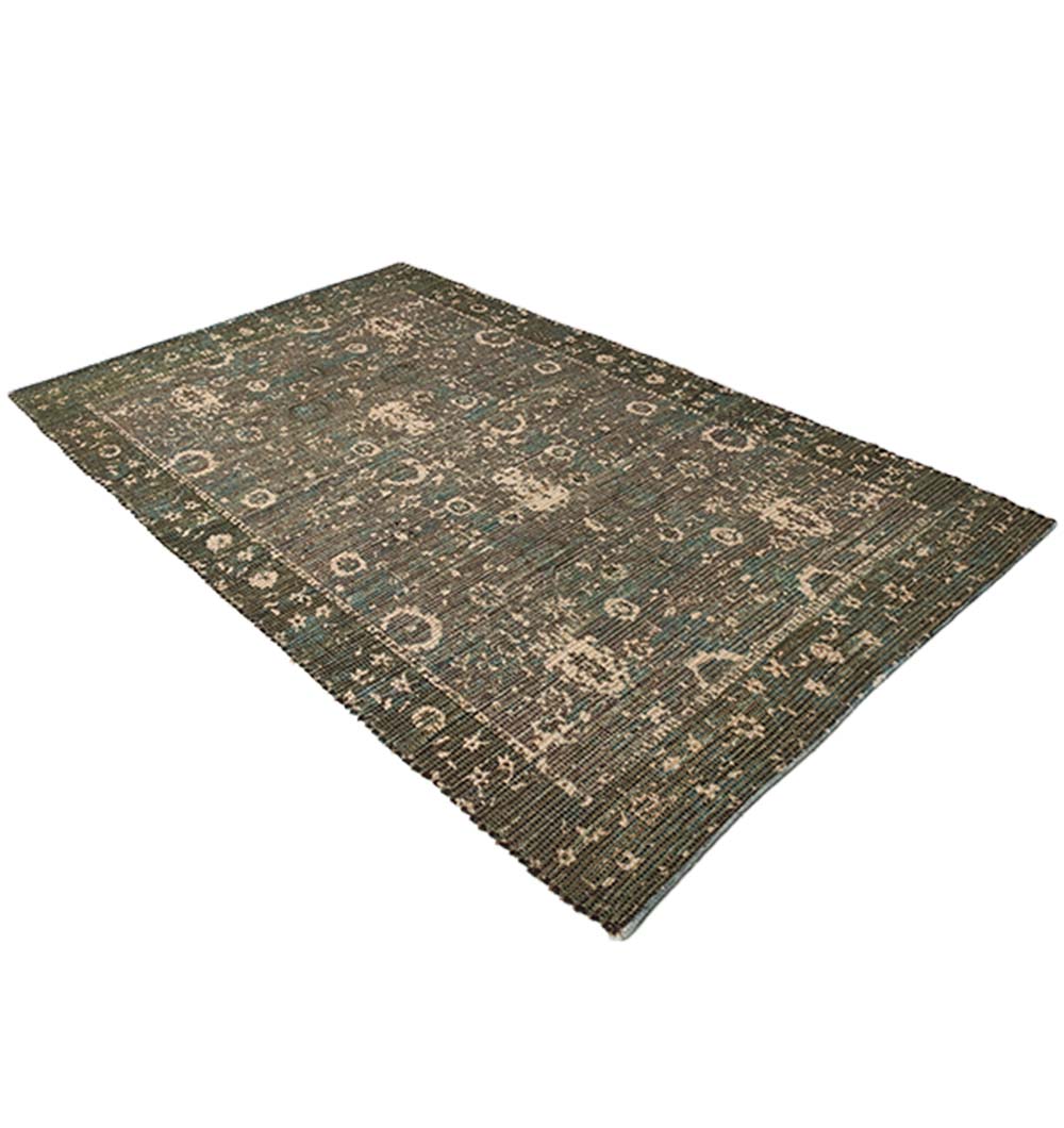The RAMSHA HOME Multi Color Printed Rug 145x240 cm (DD-026) features a distressed rectangular design with muted green, beige, floral, and geometric patterns, displayed at an angle against a white background.