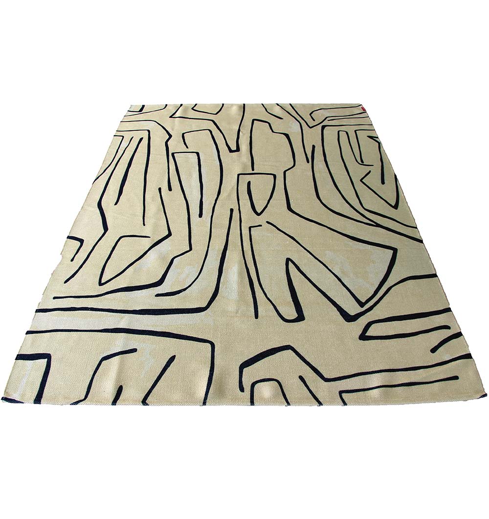 The RAMSHA HOME Multi Color Digital Printed Rug DD-032 features bold, irregular black lines forming geometric shapes on a beige background, displayed from a low angle.