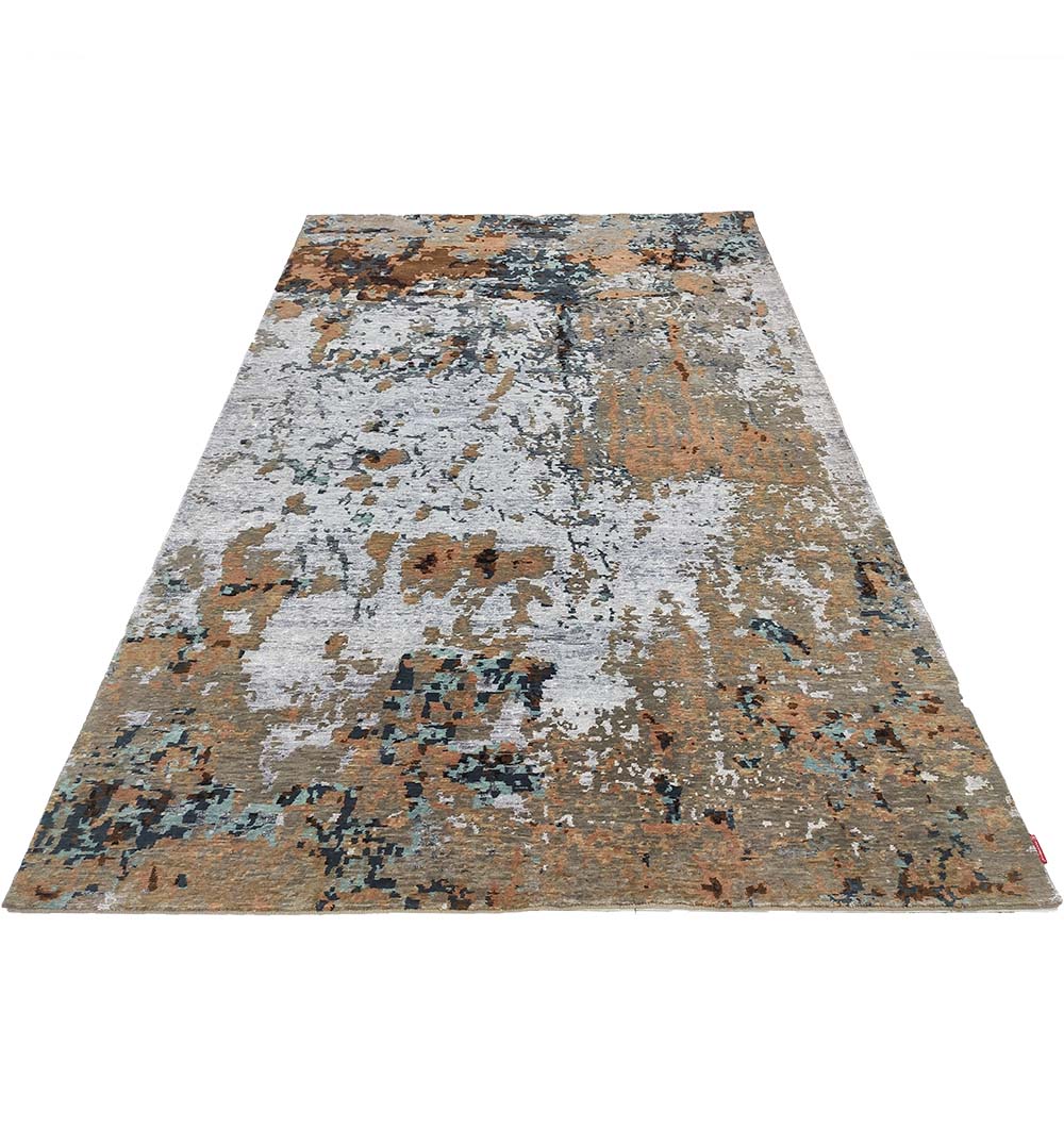 The RAMSHA HOME Bamboo Silk & Cotton Hand Knotted Carpet HKWB-012 is a rectangular rug with an abstract, mottled pattern in shades of brown, beige, gray, and blue.