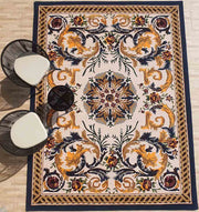 The RAMSHA HOME Polyester & Cotton Hall Decor Rug - HTP 02 (300x400cm) features an ornate, symmetrical floral and swirl design in gold, navy, red, and green. Two modern black chairs with white seats sit at the rug’s upper left corner.