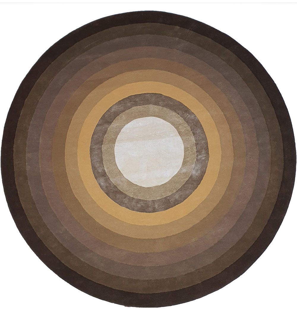 The RAMSHA HOME Multi Color Handmade Hand Tufted Carpet HTWV-49 is a round wool rug with concentric circles in brown, tan, and beige tones, creating a gradient from a light center to darker edges.