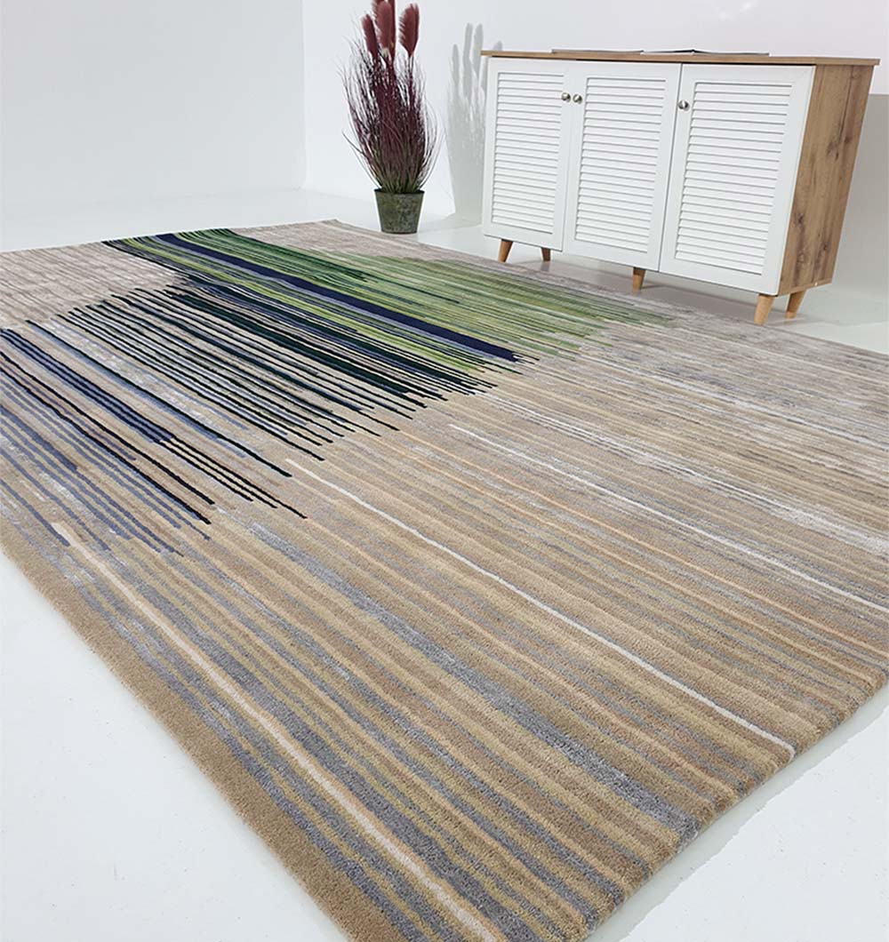 The RAMSHA HOME Striped, Beige & Grey Rug with Navy & Green Accent Bands (HTWV-52) is displayed on a white floor, paired with a white cabinet featuring wood accents and a potted plant beside it.