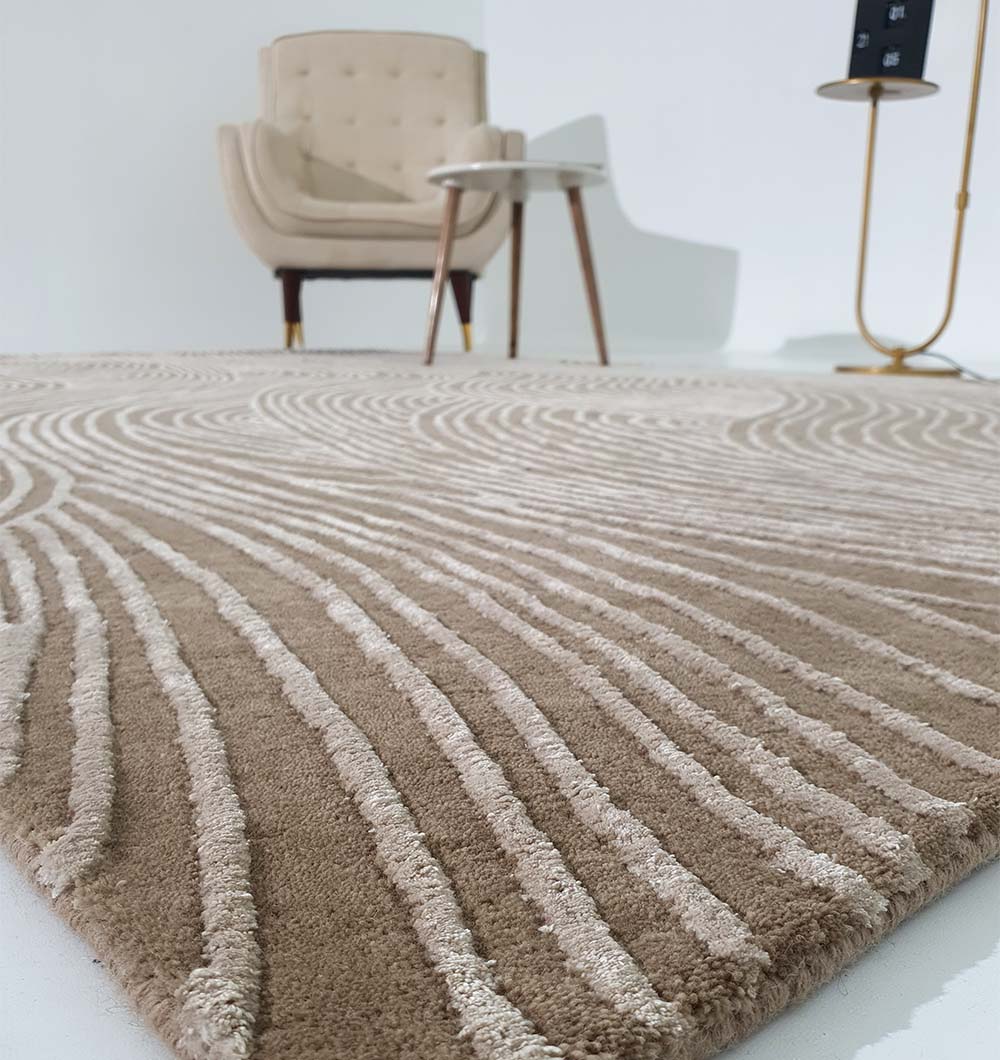The RAMSHA HOME Handmade Beige Handtufted Area Rug HTWV-53 with raised wavy patterns lies on the floor. Behind it are a light armchair, round side table, and floor lamp set against a white wall.