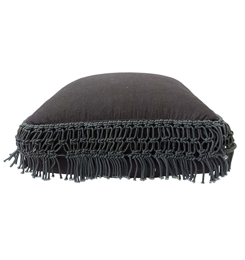 The RAMSHA HOME Black Cotton Pouf With Fringes PF-044 is a square, dark pouf with braided trim and long fringes, shown from the side against a white background, ideal for comfortable seating.