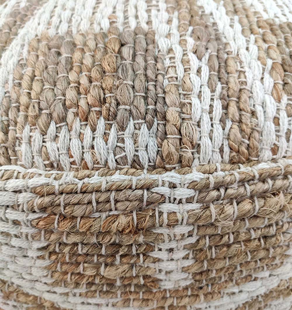 Close-up of the RAMSHA HOME Natural Jute Pouf With Leather Handle, crafted from thick beige, brown, and off-white natural fibers in a textured checkered pattern with visible stitching and raised details.