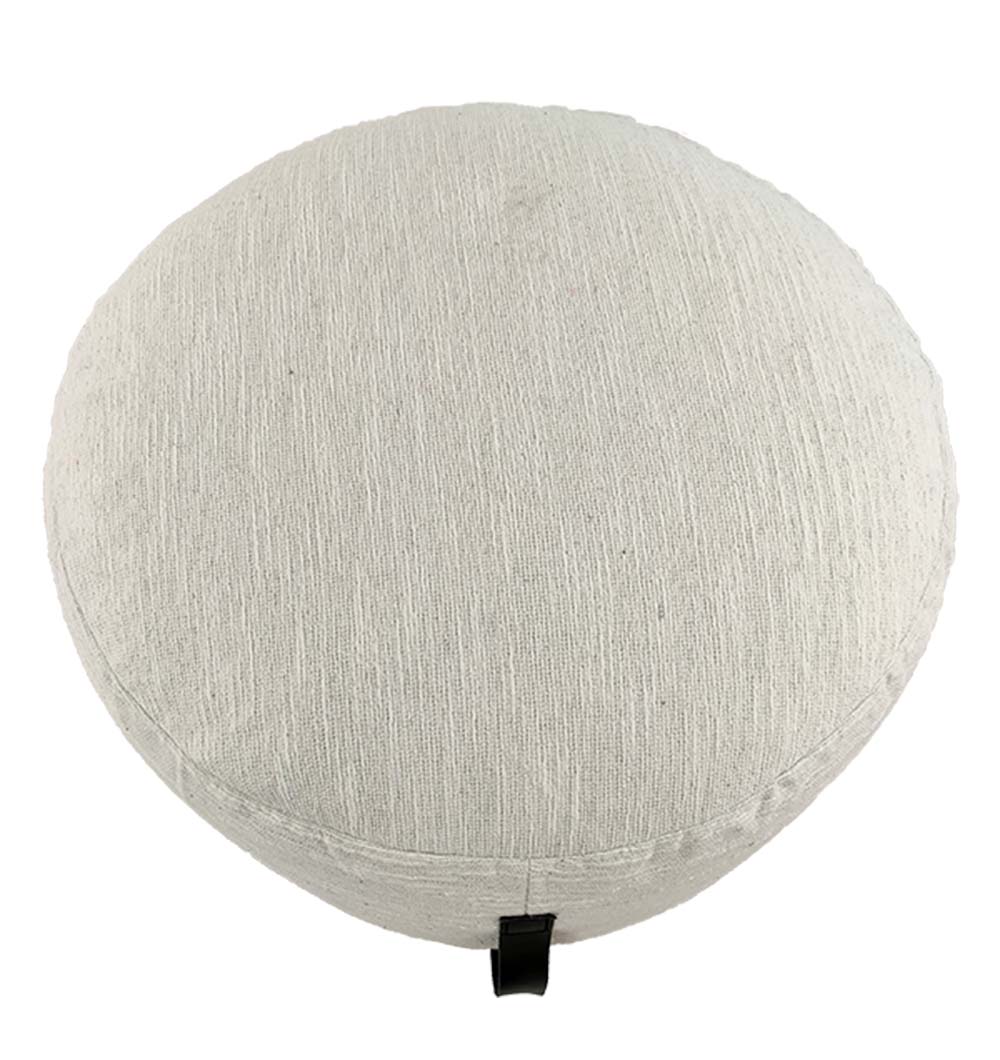 Top view of white pouf showing woven cotton texture and handle