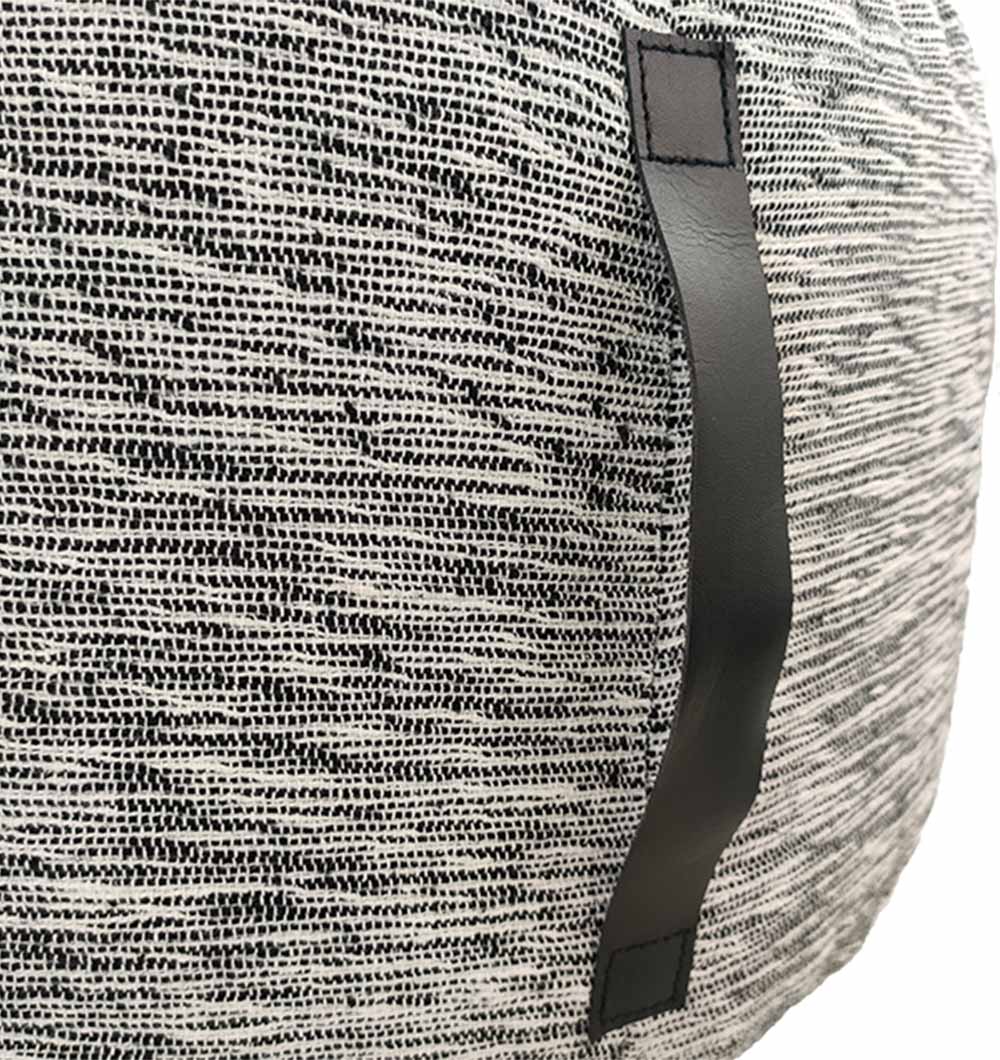 Close-up of black & white pouf showing woven cotton texture and pattern