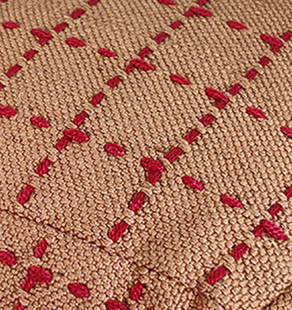 Macro shot of PF-107 pouf showing woven polyester craftsmanship and vibrant colors