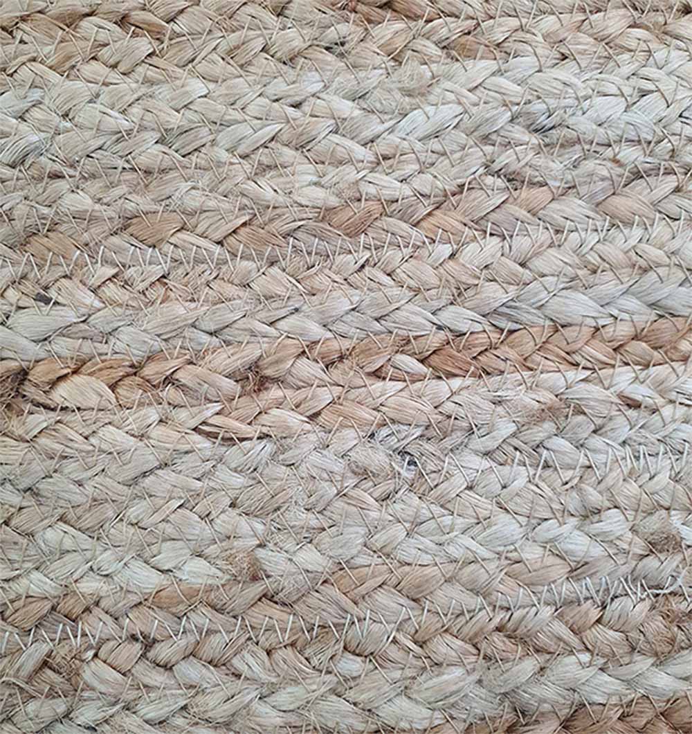 Detailed texture shot of handcrafted jute pouf highlighting intricate weave and organic pattern