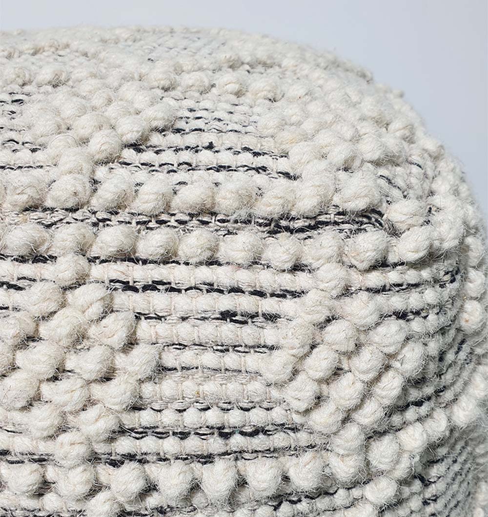 Close-up of PF-138 pouf showing soft woven wool-cotton texture