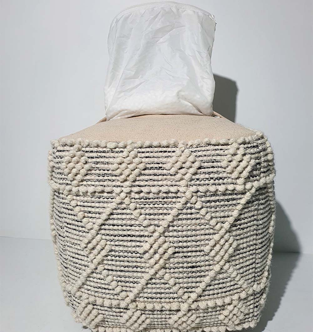 Detail of PF-138 pouf rear angle showing handcrafted natural fabric