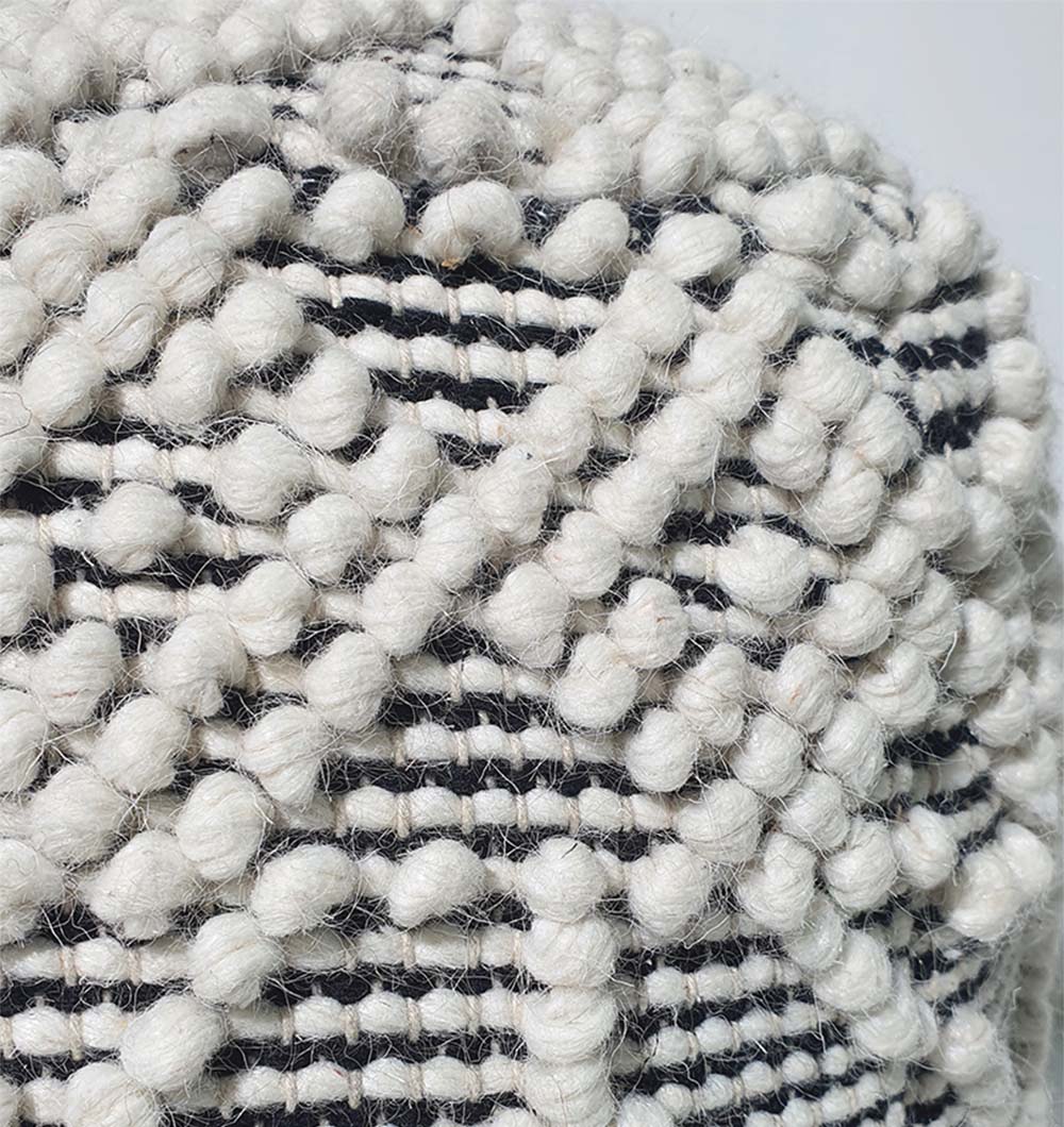 Close-up of handmade PF-140 pouf showing natural wool and cotton texture