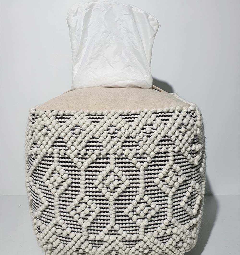 PF-140 pouf from behind, emphasizing square shape and neutral woven fabric