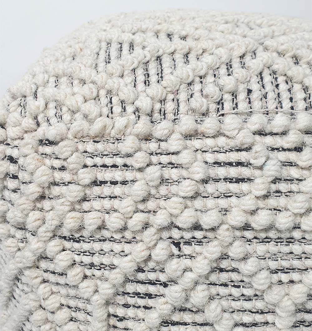 Close-up of PF-141 natural color pouf showing wool-cotton cover texture and handcrafted details