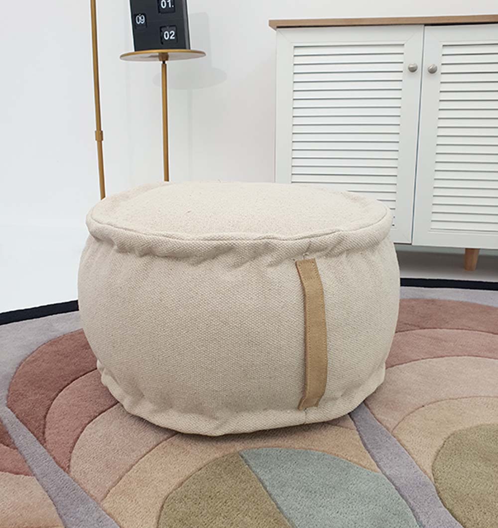 Decorative multi-color round pouf with soft polyester cover, perfect for seating