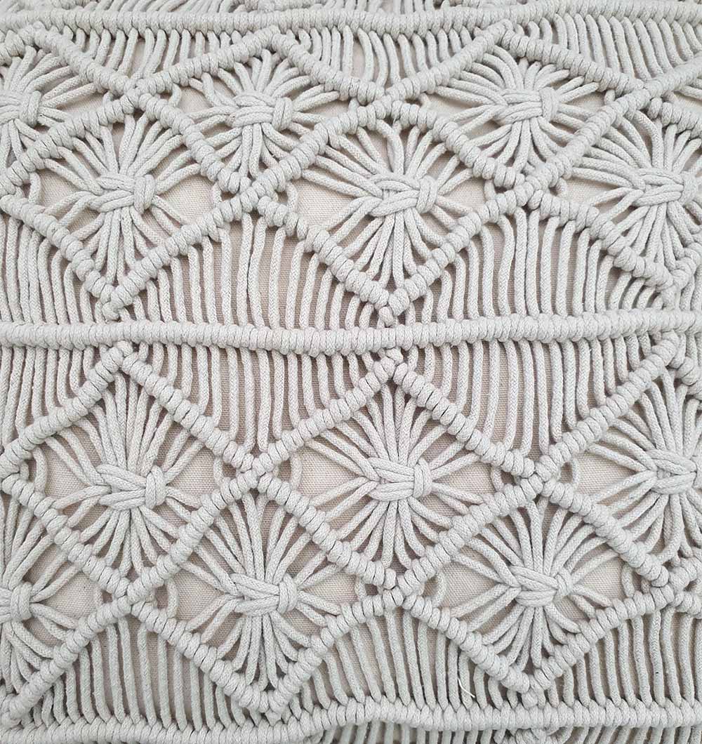 Close-up of RAMSHA HOME’s Cotton Cushion CS-276 featuring intricate, handmade macramé in a geometric diamond pattern with thick, off-white cord on a neutral fabric background.
