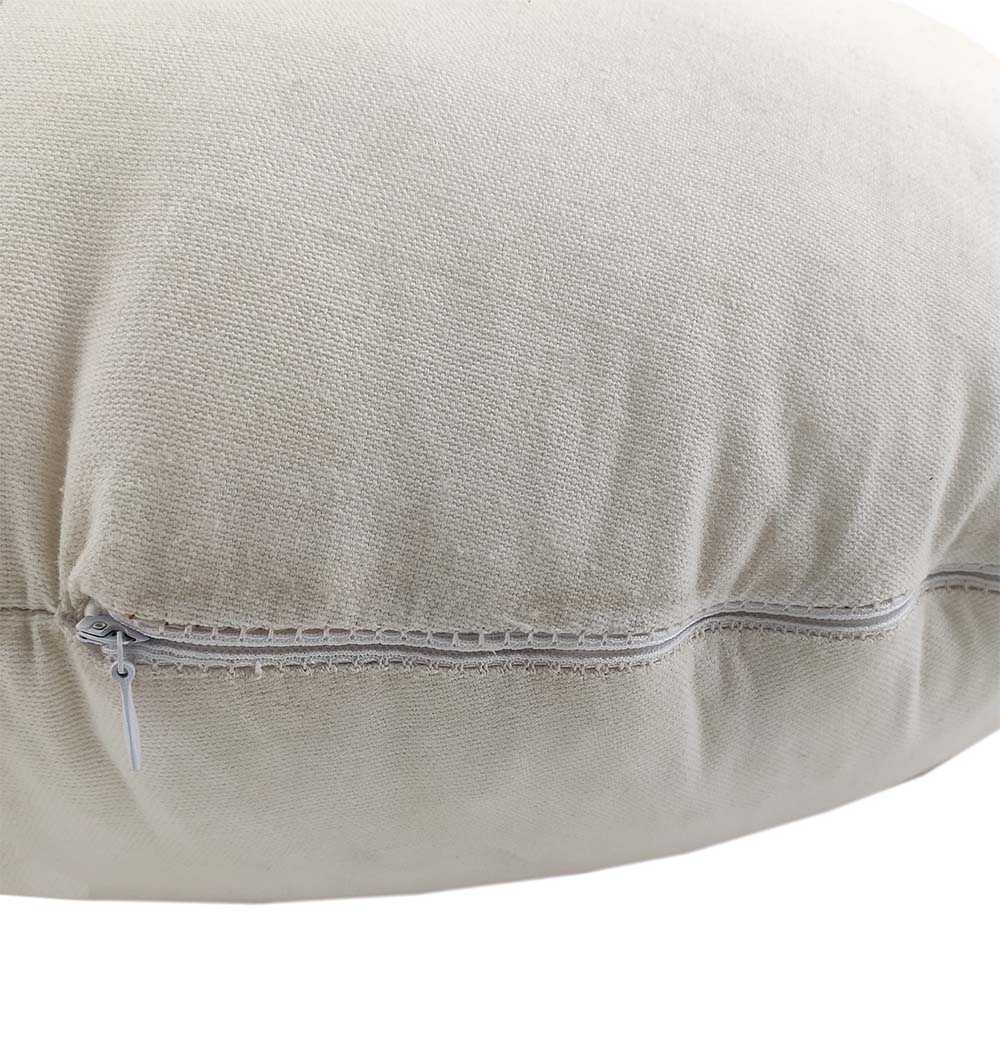 A close-up of the RAMSHA HOME Cotton Cushion CS-223 highlights its textured beige cotton cover and shows a white zipper partially visible along one edge.
