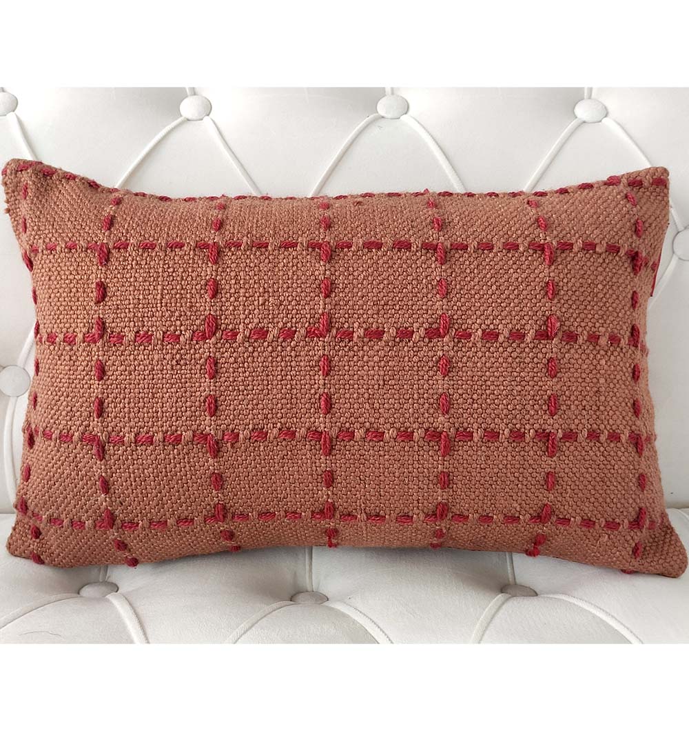 The RAMSHA HOME Woven Cushion Red Color Soft Cushion With Insert (CS-251) features a red grid pattern, adding comfort and stylish flair to any white tufted surface.