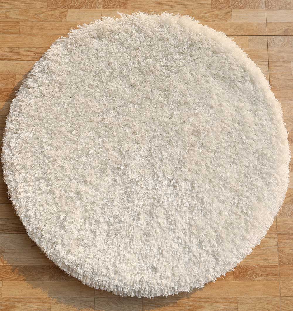 The RAMSHA HOME Decorative Shaggy Rug White Color (SG-012) features a fluffy texture and round shape, bringing cozy charm to any wooden floor.