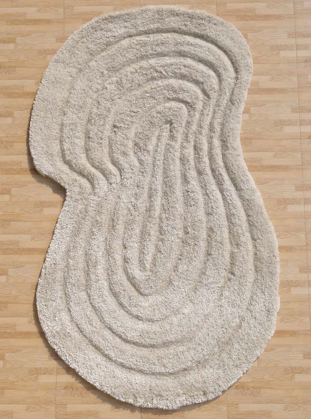 The RAMSHA HOME Wavy Texture Shape Rug for Living Room - SG 016 (200 x 300 cm) in cream, with plush layered wavy contours inspired by topographic lines, adds a cozy accent on the light wood floor.
