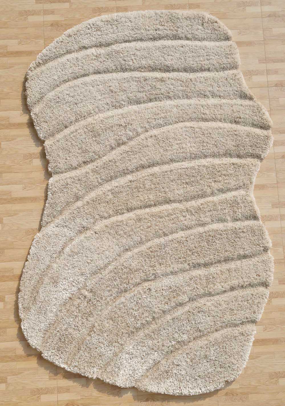 The RAMSHA HOME Shaggy Shape Rug for Living Room - SG 017 (200x300 cm) features a plush, wavy beige and cream design with raised, curved lines, adding a soft and textured look to any light wood floor.