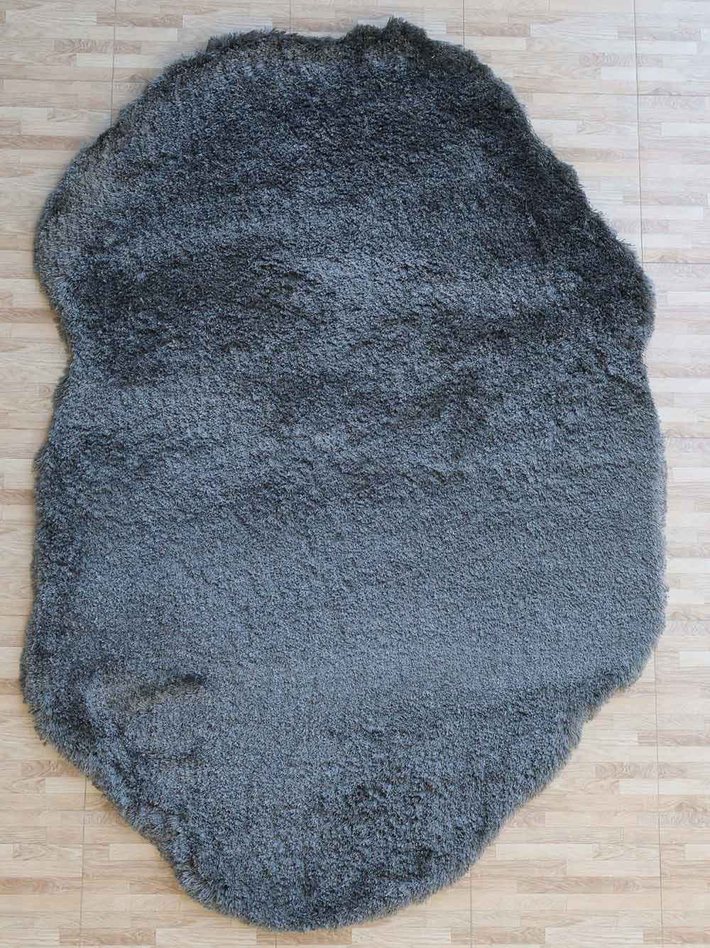 The RAMSHA HOME Shaggy Shape Rug for Living Room (SG 022, 200x300 cm) features a plush, fluffy gray surface and irregular edges, adding style to the light wood floor.