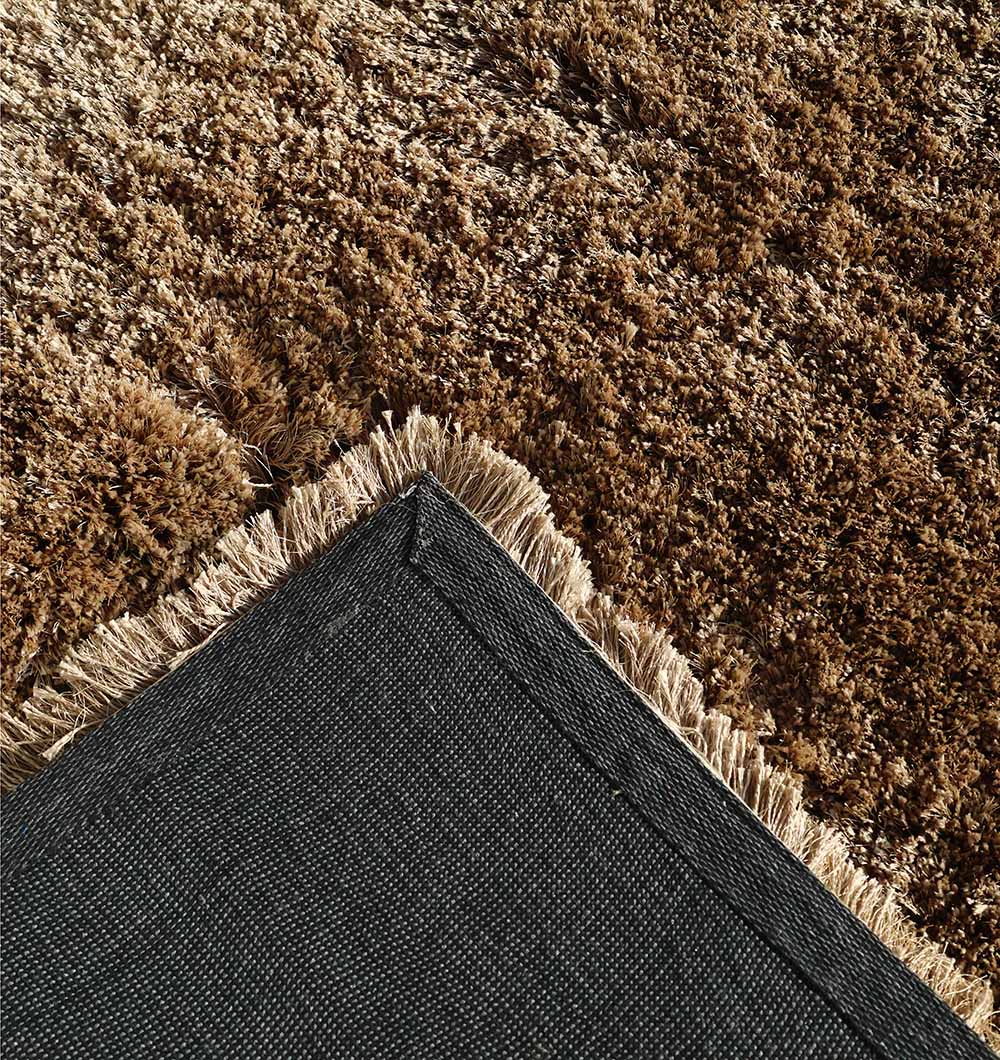 Close-up of the RAMSHA HOME Premium Shaggy Rug for Ramadan Gifting - SG 025-A, featuring beige fringe, a textured surface, and black fabric backing—ideal for your Ramadan sale.