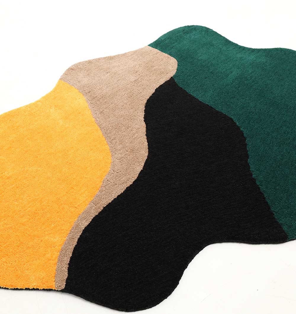 The RAMSHA HOME Shaggy Rug for Living Room - SG 036 (160x230 cm) has an abstract, irregular shape with wavy edges and four colors—yellow, beige, green, and black—in curved patterns on a white background.