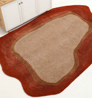 The RAMSHA HOME Shaggy Rug for Living Room - SG 038 (160x230 cm), featuring beige, brown, and red layers in an irregular shape, adds warmth beside a wooden cabinet with white louvered doors on a white floor.