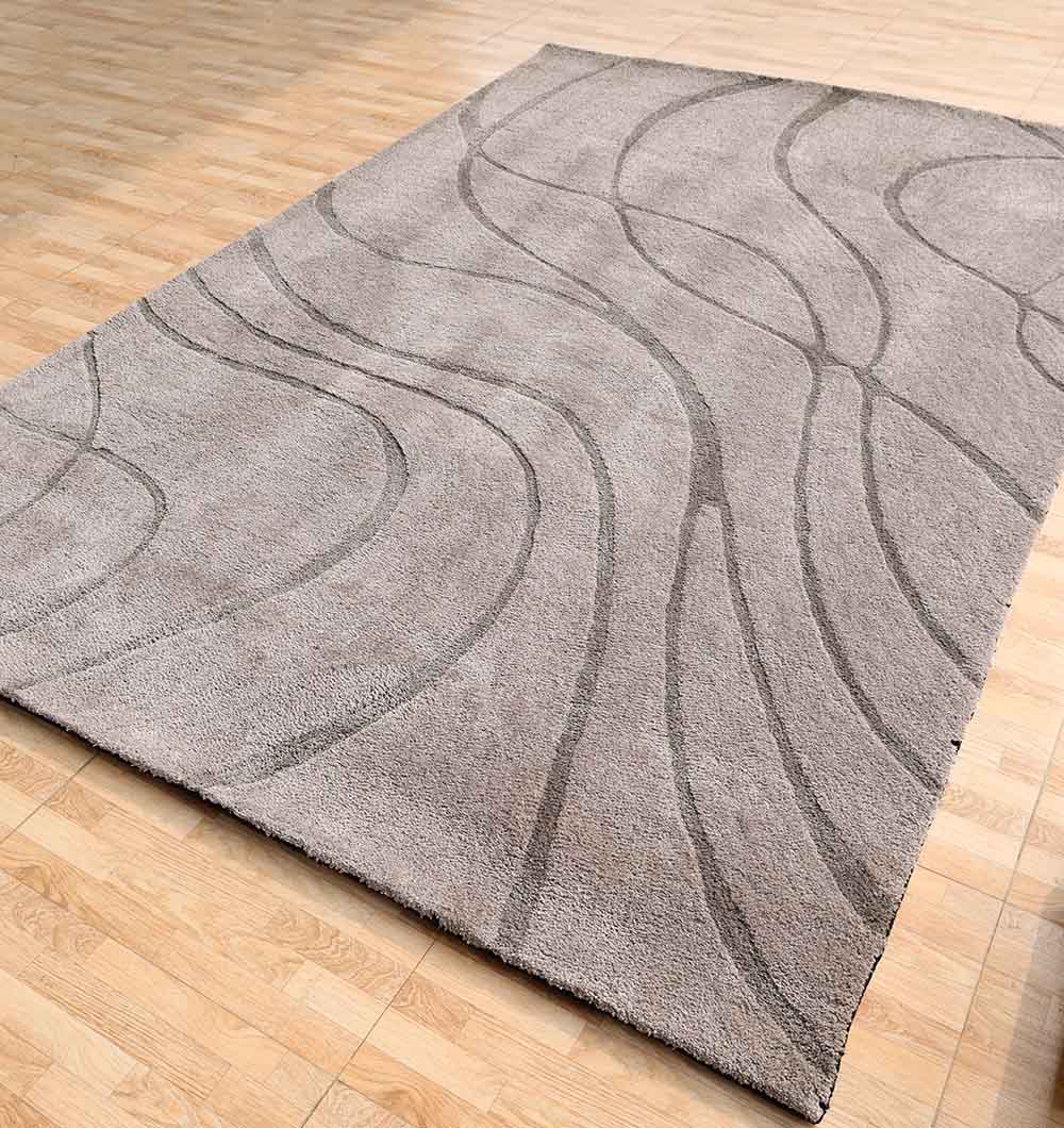 The Shaggy Rug for Living Room - SG 039 (200x300 cm) by RAMSHA HOME features subtle wavy lines in a modern grey, creating a contemporary accent on light wood floors in any space.