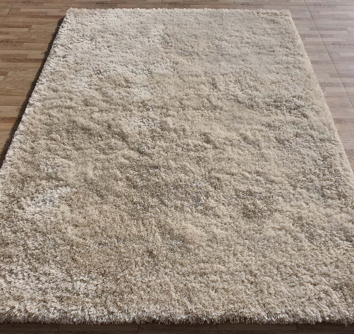 A rectangular Gold Color Shaggy Area Rug (SG 03 B) by RAMSHA HOME, designed for large living rooms, is placed on a light brown wooden floor and viewed from above.