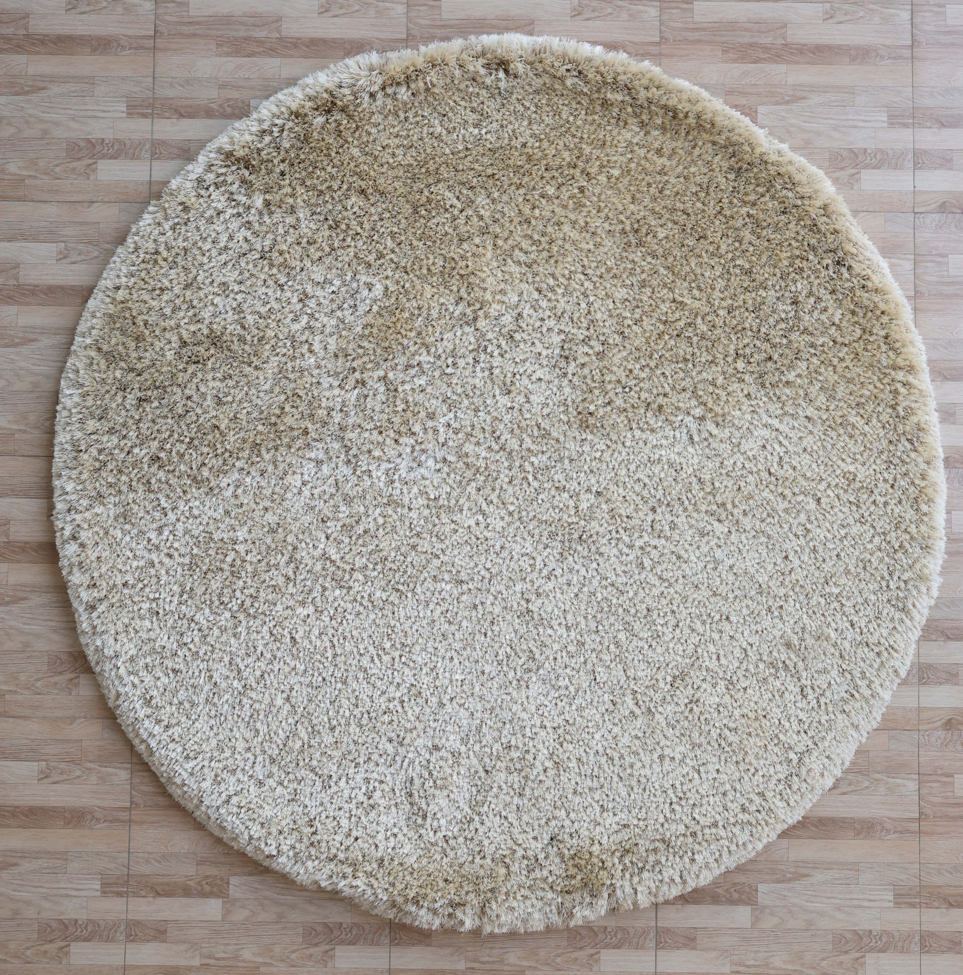 The RAMSHA HOME Modern Ultra Soft Shaggy Carpet for Bedroom - SG 041, in cozy beige, features plush, fluffy texture and subtle color variations, adding warmth and modern style to any space with its tile-like patterned, light brown look.