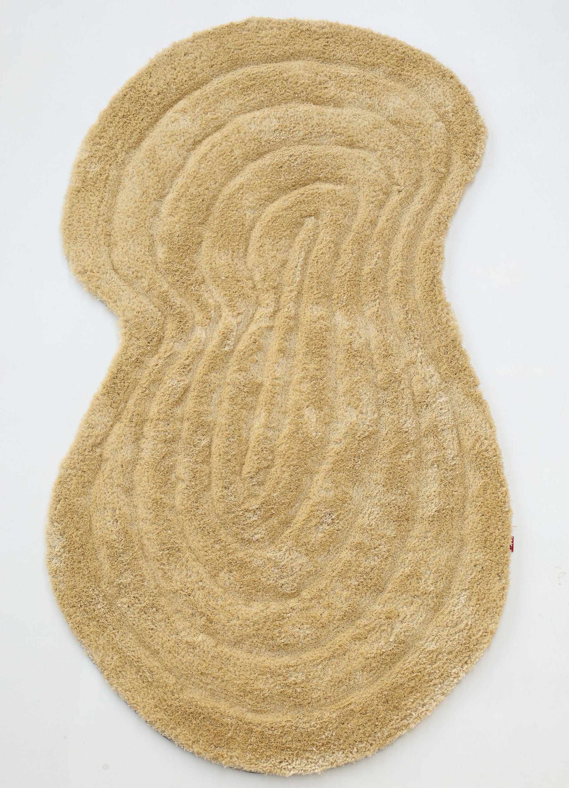 The RAMSHA HOME Gold irregular Shaped Home Decor Shaggy Rug - SG 041 3D features organic wavy patterns and a textured, tree ring-like design, bringing depth and unique style to any space. Shown on a white background.